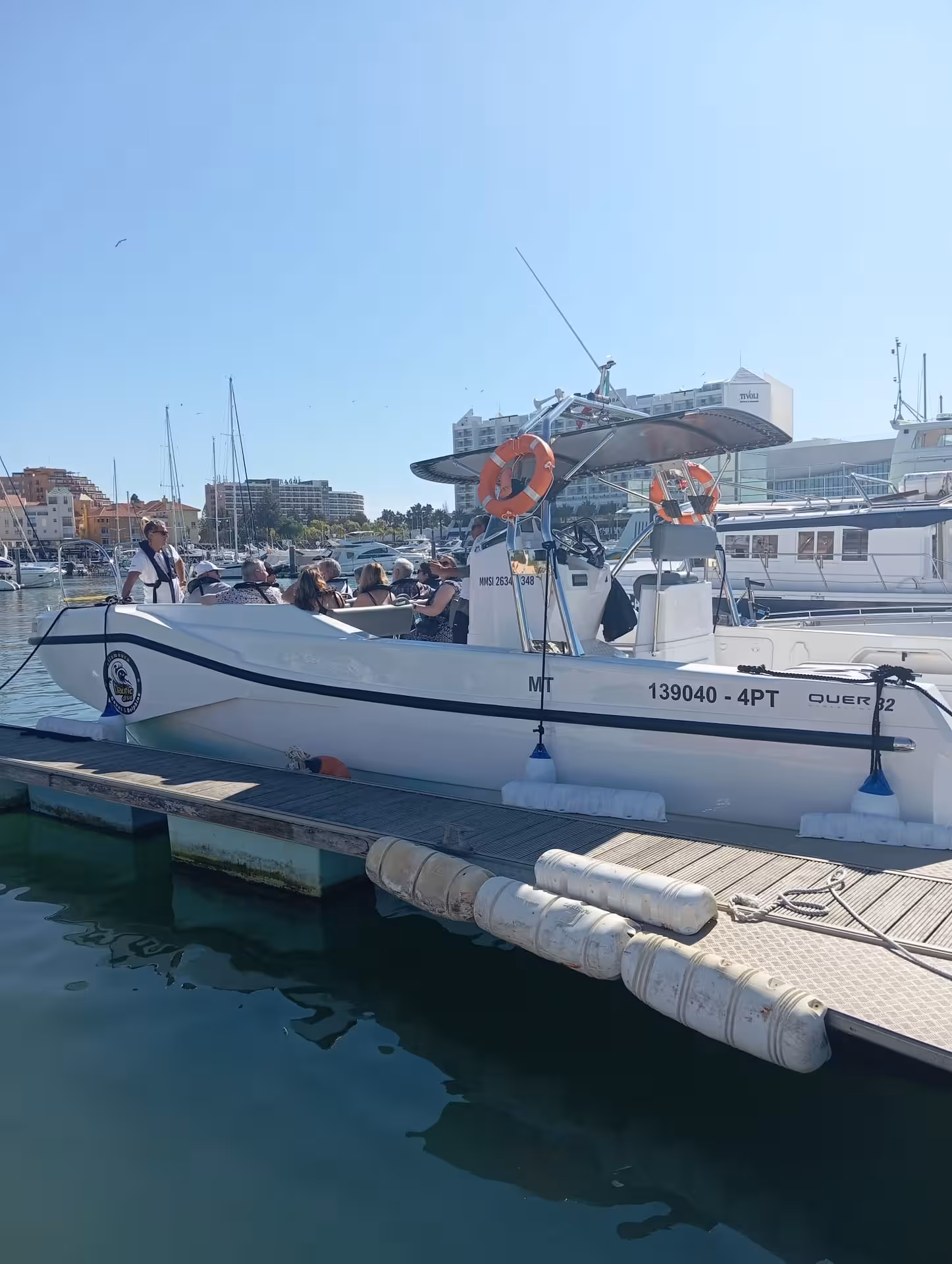 Small group boarding a speedboat in Vilamoura Marina for a Benagil caves and dolphin watching tour along the Algarve coast