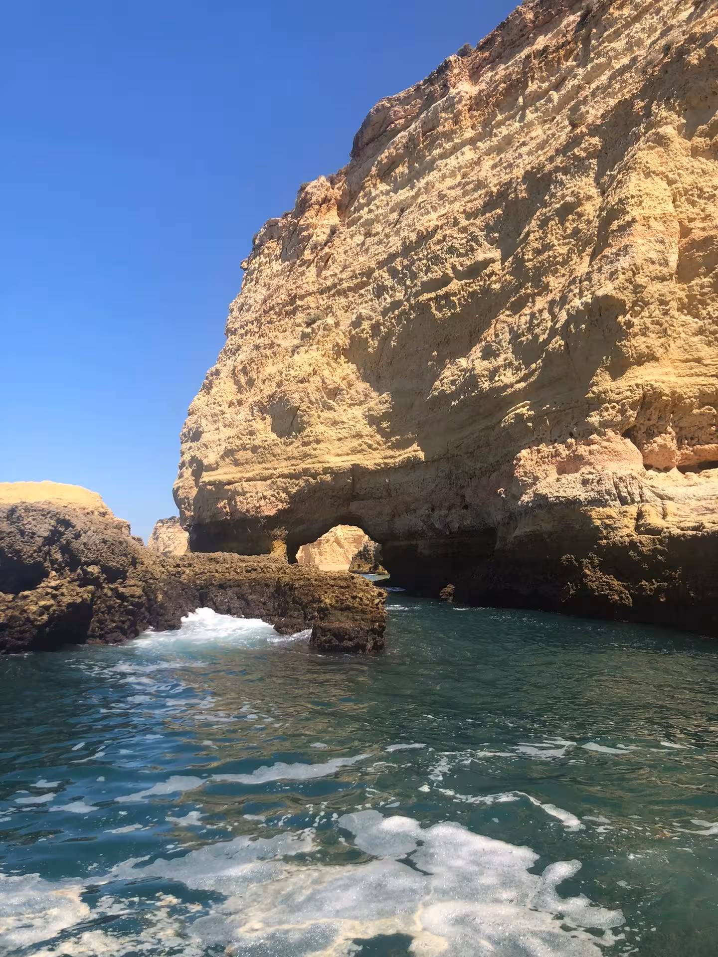 Majestic limestone cliffs and arches at Marinha Beach, a highlight of the Benagil & Marinha coastal tour.