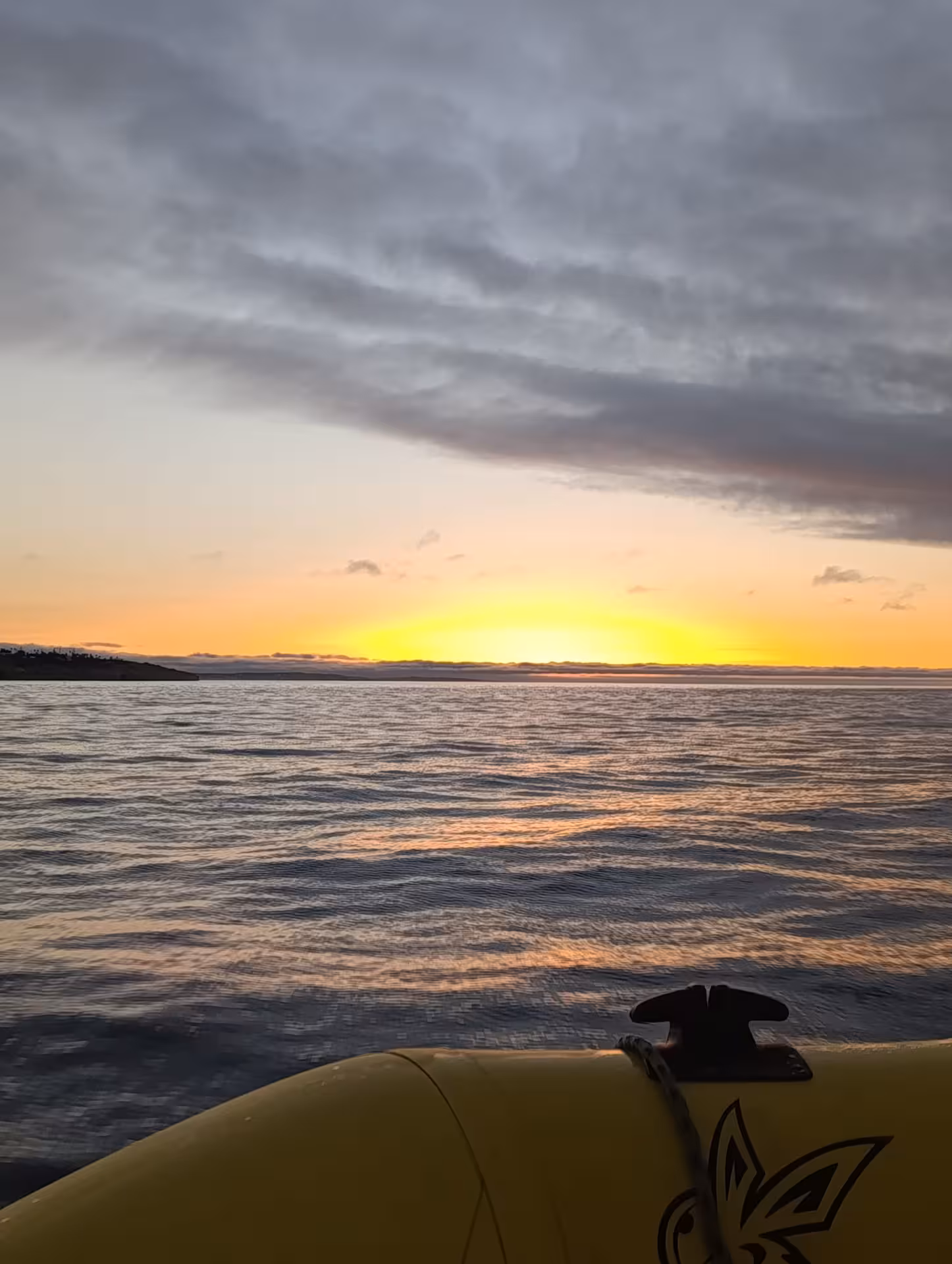 Vibrant sunrise horizon viewed from a boat on the Benagil sunrise experience tour in Algarve