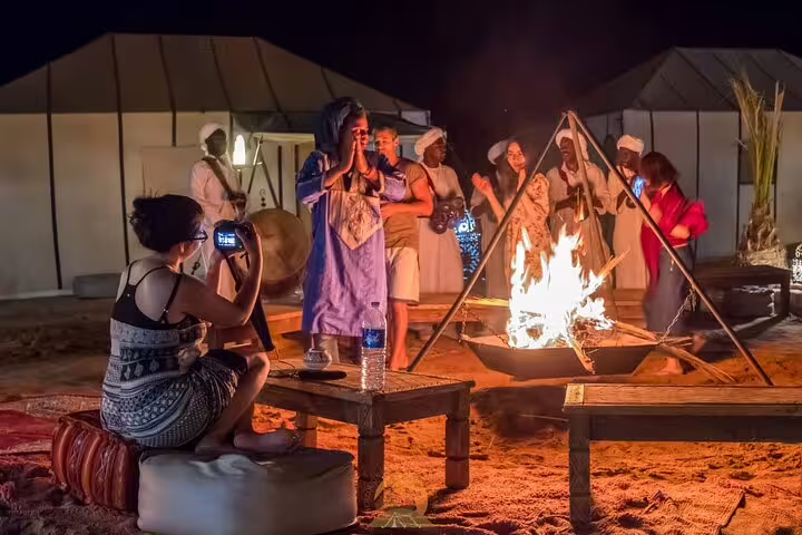 Berber campfire music at Sahara desert camp on private 6-day Casablanca to Marrakech tour with Merzouga night