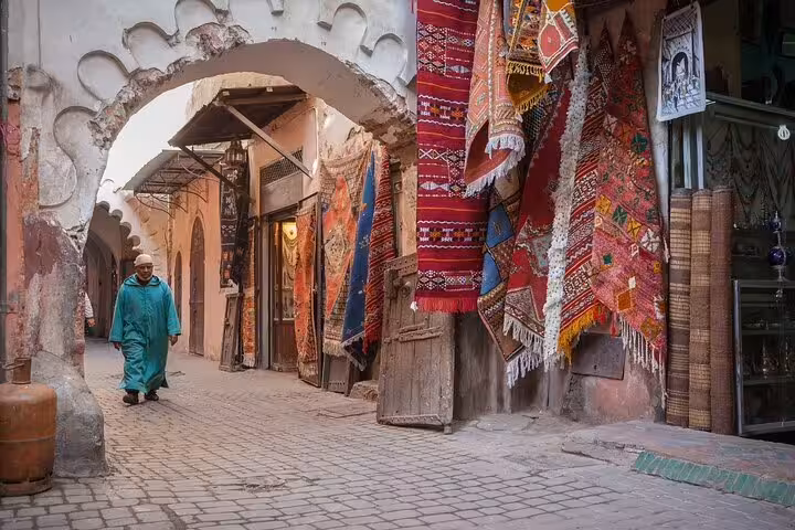 Medina alley with Berber carpets on private 6-day desert tour from Casablanca to Marrakech via Marrakech souks