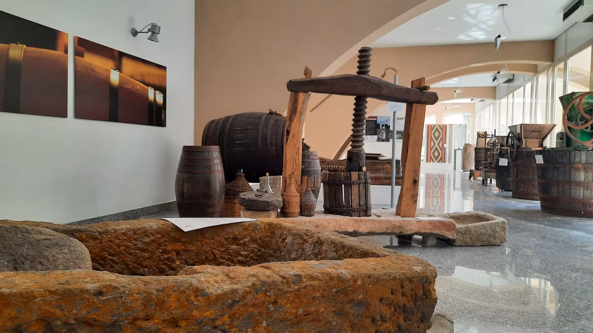 Rustic wine production equipment at Berchidda Wine Museum, highlighting Sardinian viticulture heritage.