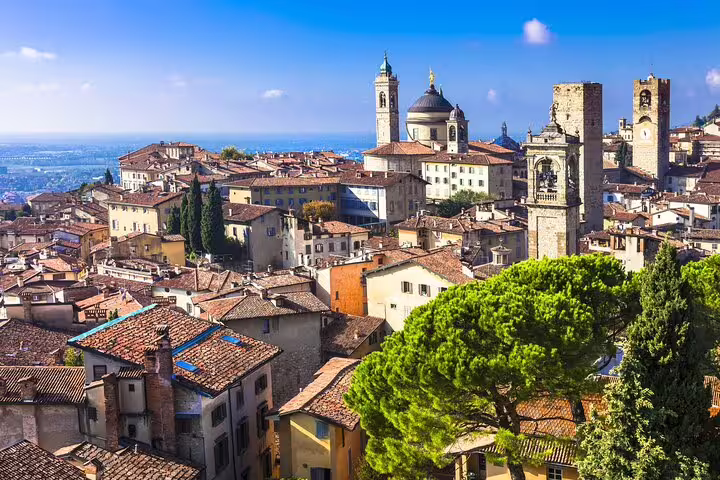 Panoramic view of Bergamo Alta with medieval towers, Città Alta rooftops and Duomo domes on a private 2.5-hour walking tour