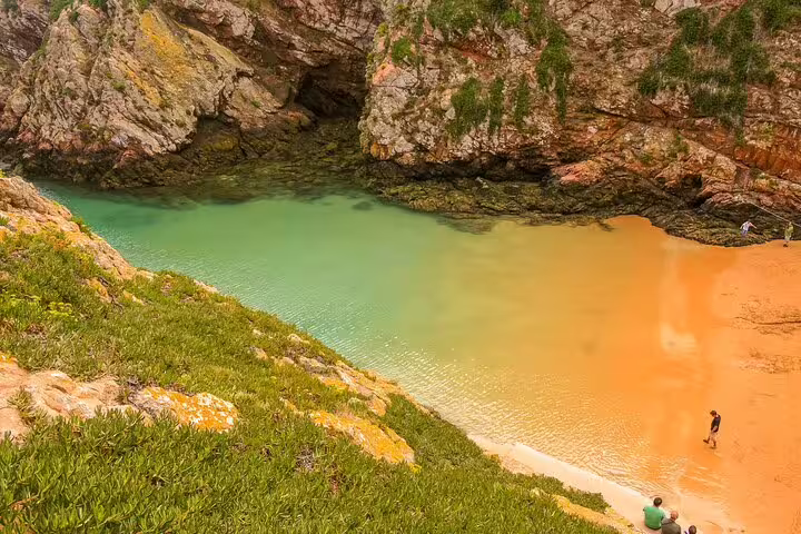 Scenic view of Berlengas Island's secluded cove with turquoise waters and golden sands, perfect for a private day tour from Lisbon.