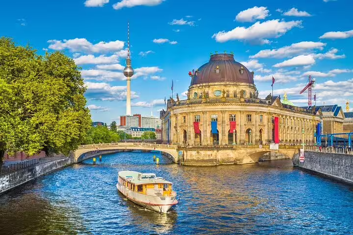 Boat cruise on River Spree with Bode Museum and Berlin TV Tower on a sunny day