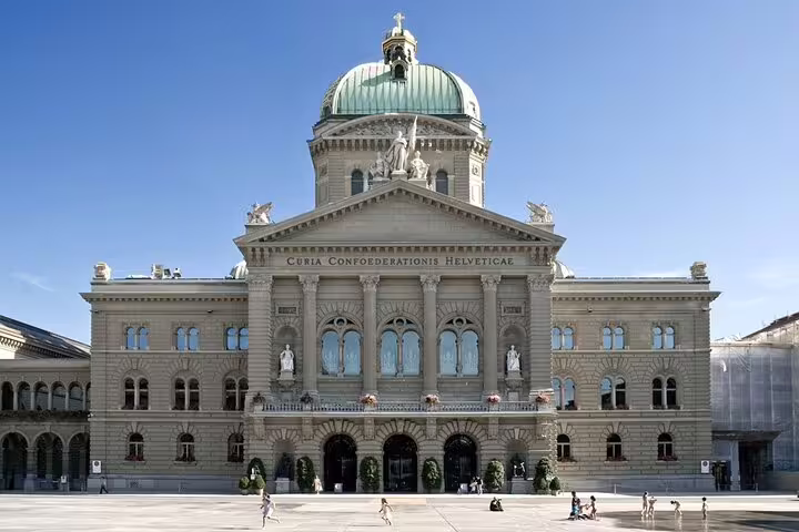Federal Palace of Switzerland with green dome and neoclassical facade in Bern city center