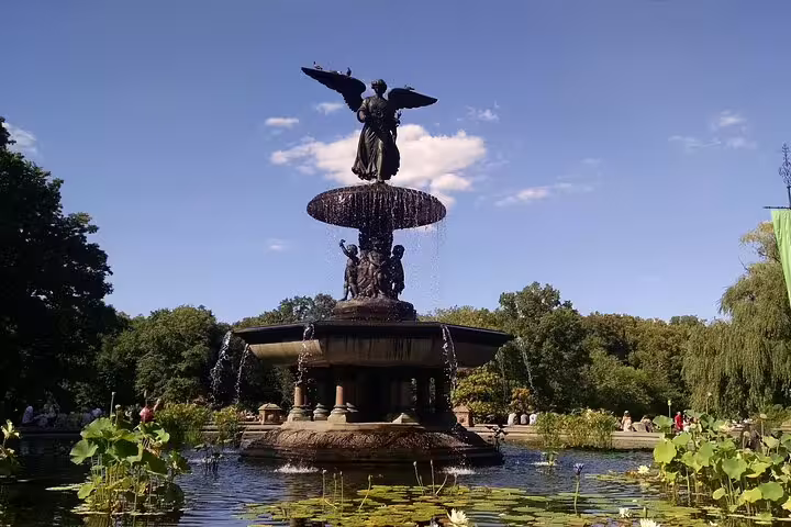 Bethesda Fountain with angel statue surrounded by lily pads in Central Park NYC