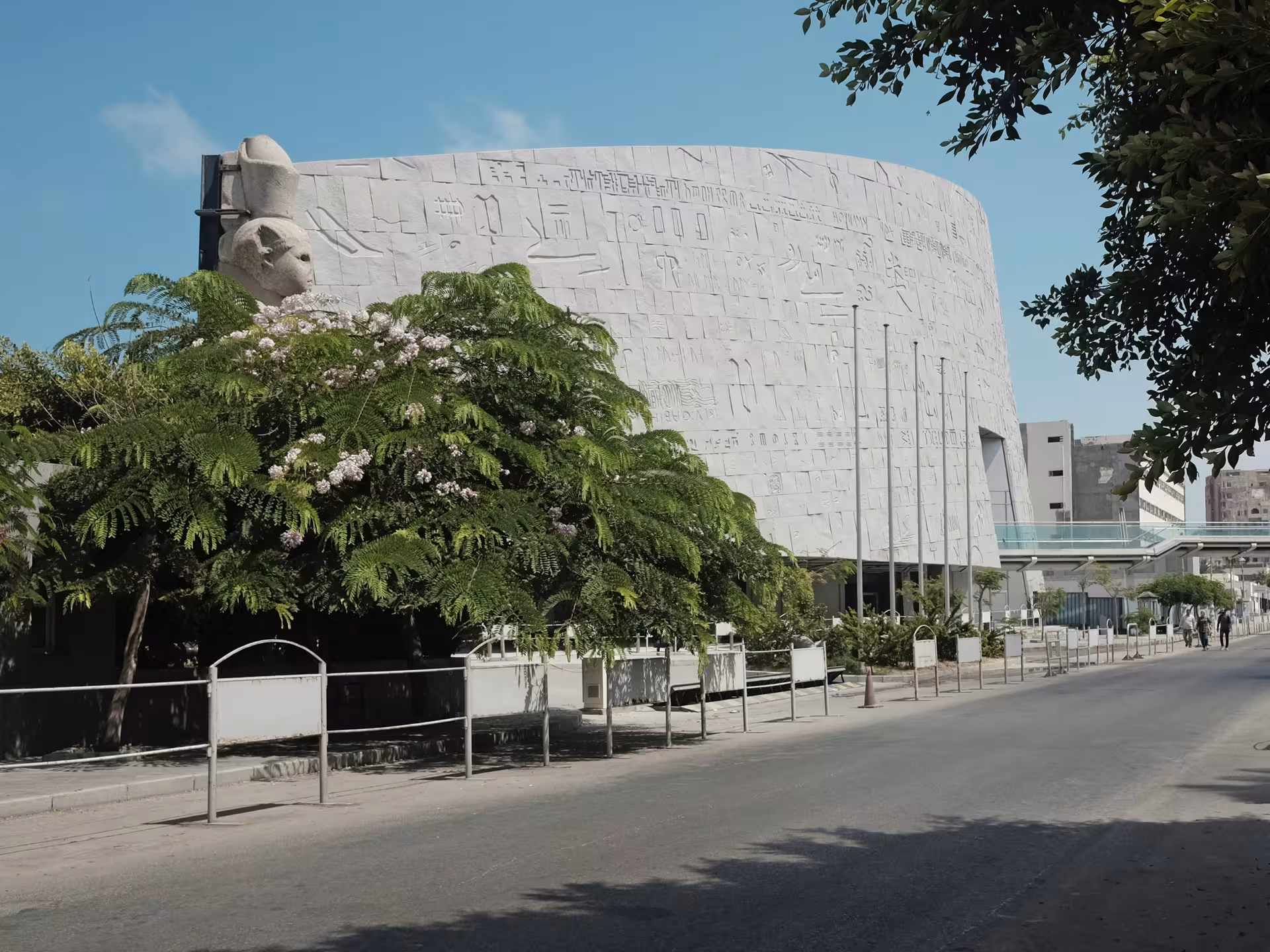 Bibliotheca Alexandrina exterior with hieroglyphic engravings on curved stone facade, Alexandria Egypt