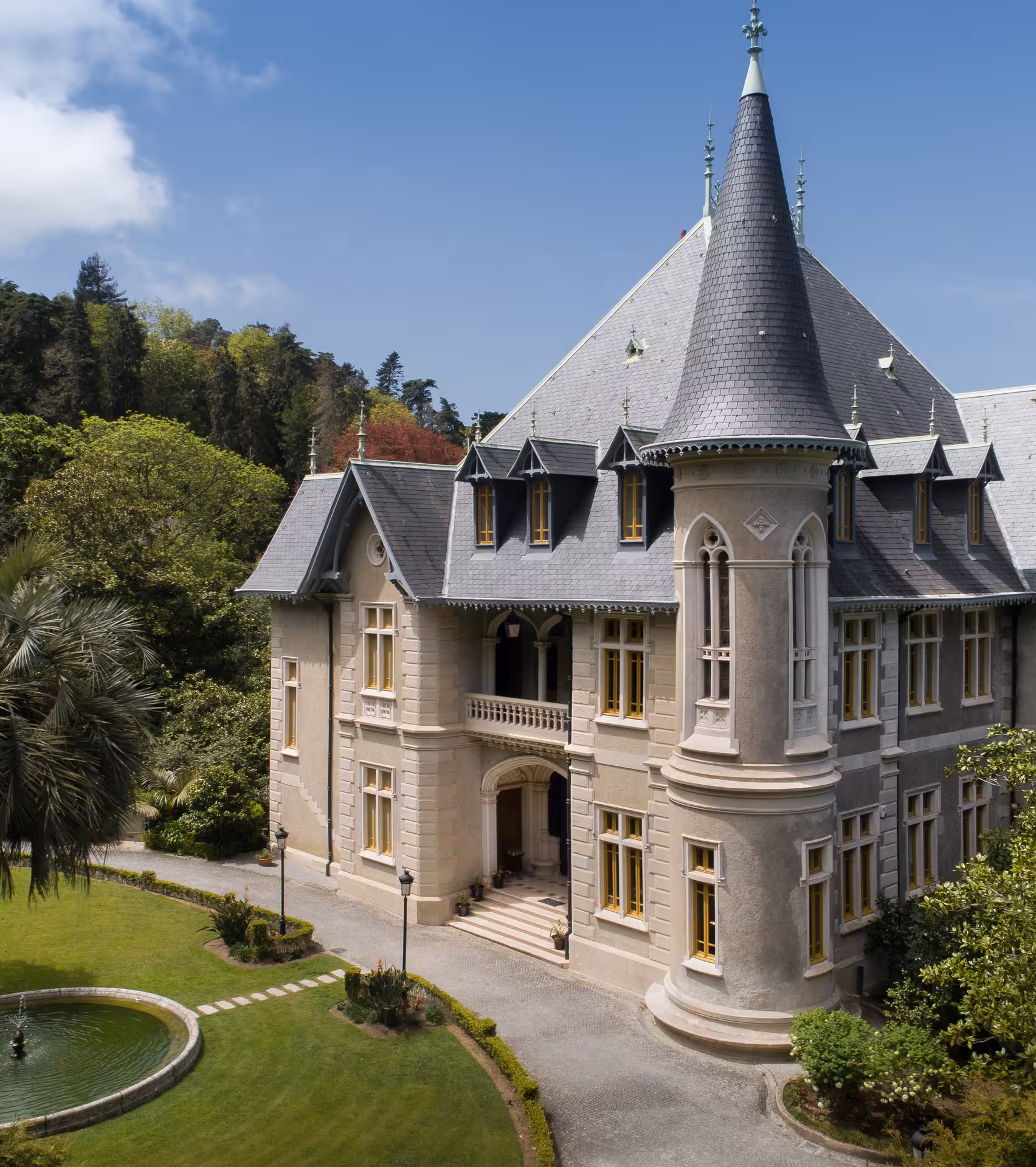Aerial view of Biester Palace Sintra showcasing its romantic Neo-Gothic turret and lush palace gardens