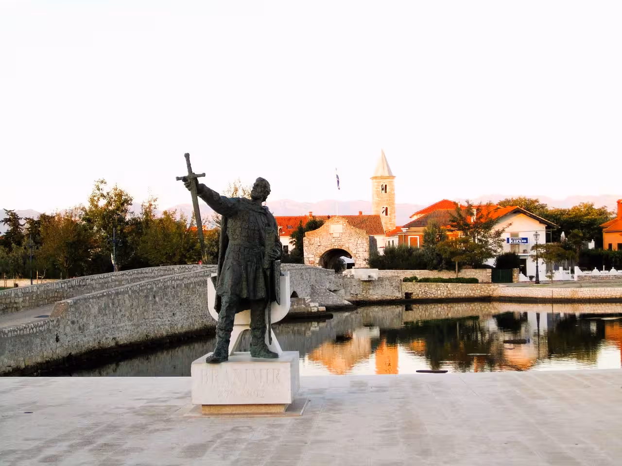 Statue of Bishop Grgur Ninski by the old bridge in Nin lagoon, part of the Nin & Zadar churches and beach tour