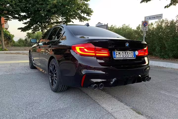 Sleek black BMW sedan ready for a premium private transfer from Karlsruhe Airport to Baden-Baden Germany