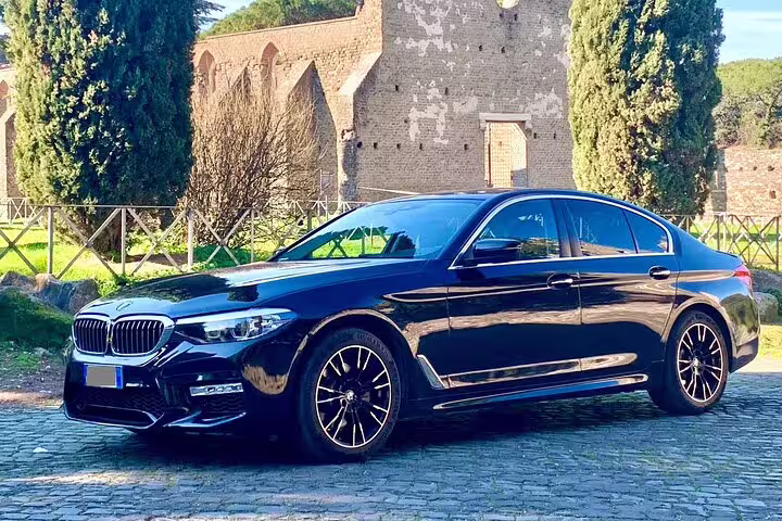 Sleek black BMW sedan for private arrival transfer from Orly Airport ORY to Paris city center.
