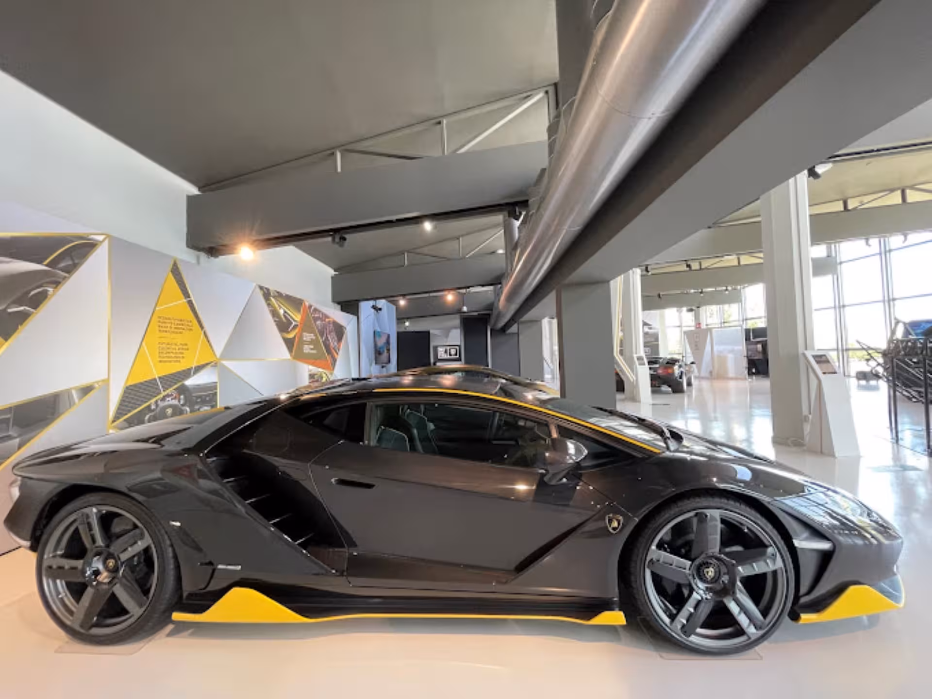 Black Lamborghini supercar inside Automobili Lamborghini Museum near Bologna, part of Lamborghini and Ducati tour