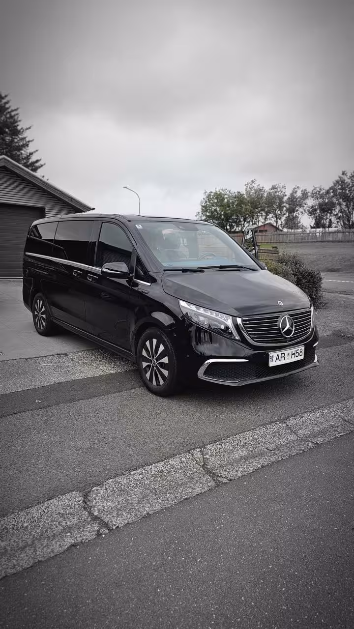 Black Mercedes-Benz EQV luxury minivan for private airport transfer service in Iceland