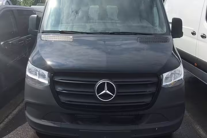 Black Mercedes-Benz Sprinter van front view for luxury private transfer service