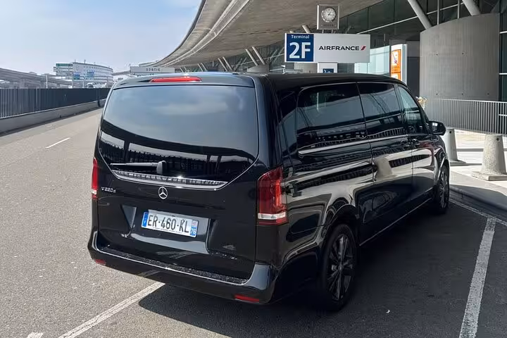 Black Mercedes V-Class minivan at Paris CDG Airport Terminal 2F Air France departure zone