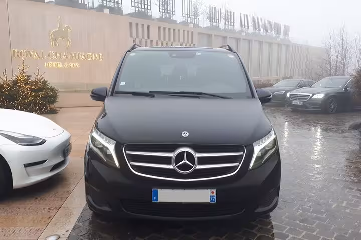 Black Mercedes-Benz V-Class van parked at Royal Champagne Hotel & Spa near Versailles