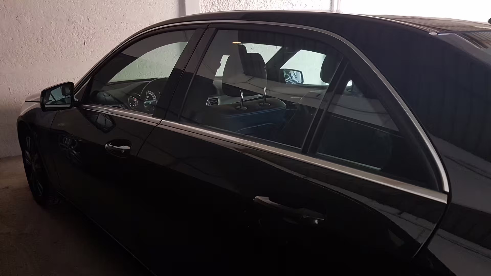Black executive sedan ready for private transfer from Civitavecchia cruise port to Rome Fiumicino airport