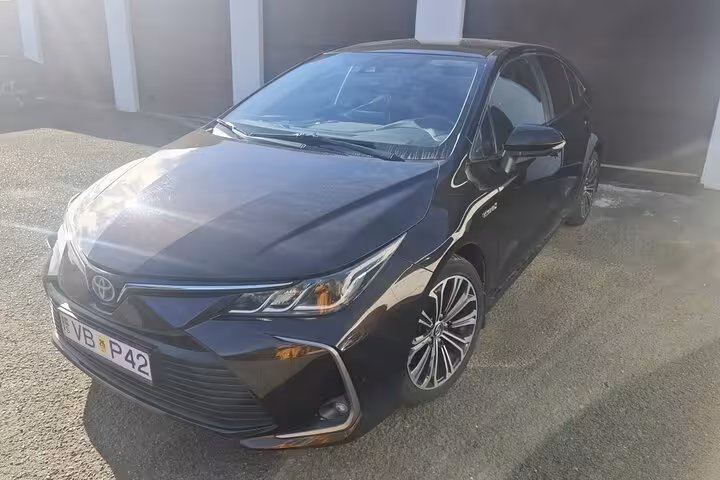 Black Toyota hybrid sedan for private transfer from Keflavik Airport to Reykjavik