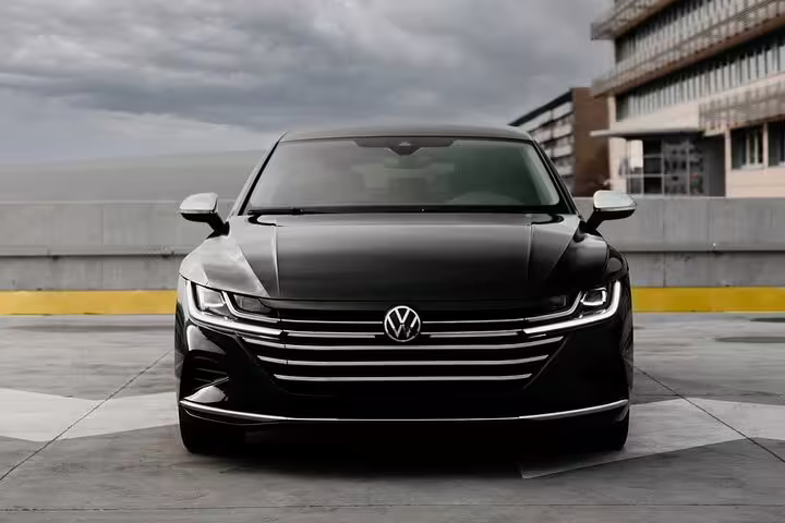 Black Volkswagen Arteon premium sedan front view for Paris to Lourdes private transfer