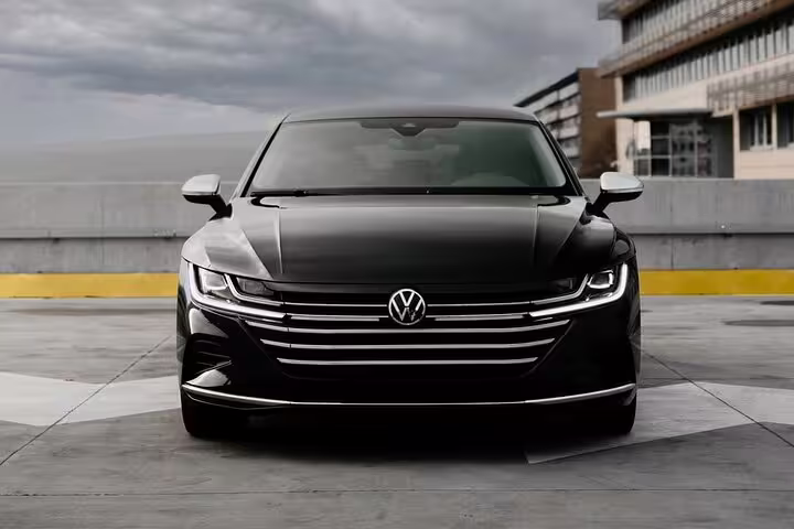 Black Volkswagen Arteon sedan front view for private transfer from Lucerne to Frankfurt
