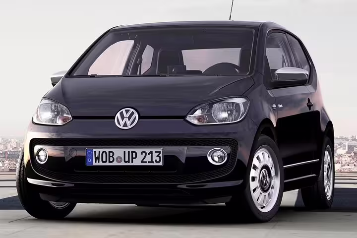 Black Volkswagen Up compact car front view with German license plate WOB UP 213