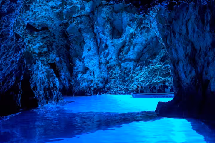 Boat inside the glowing Blue Cave on Biševo during Hvar Vis and Pakleni Islands group speedboat tour