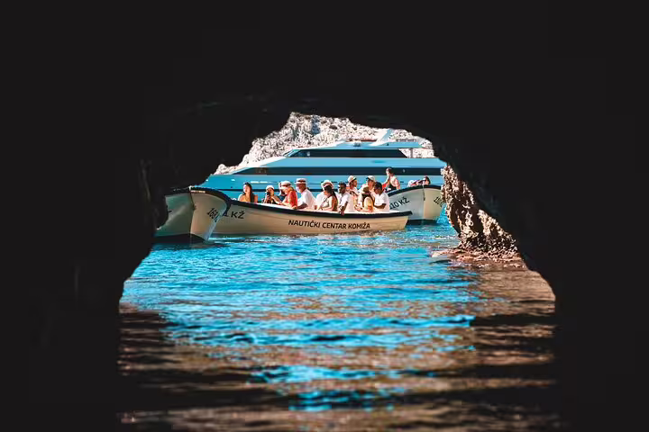 Speedboats inside the Blue Cave on Biševo, highlight of the Scheduled Blue Cave & 5 Islands tour Croatia
