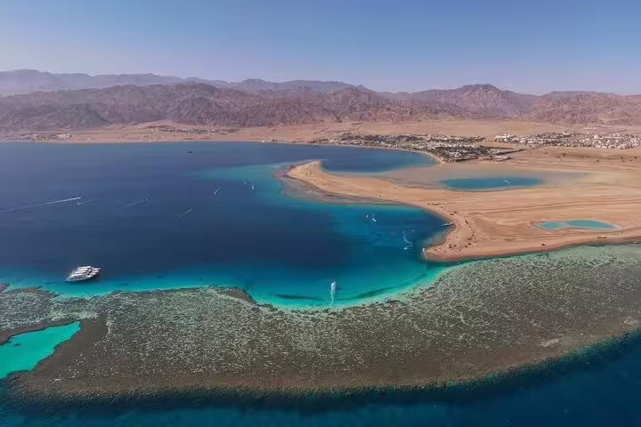 Aerial view of Dahab lagoon and turquoise Red Sea reefs, highlight of Blue Hole and Dahab day trip from Sharm