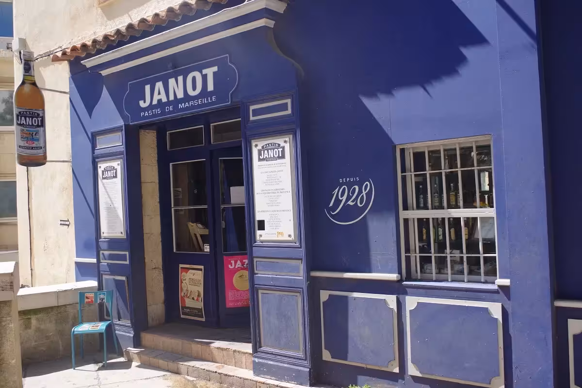 Blue Janot pastis distillery storefront in Marseille Old District, stop on street art, craft and wine tour
