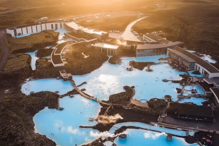 Aerial view of Blue Lagoon geothermal spa with turquoise waters surrounded by lava fields near Reykjavik