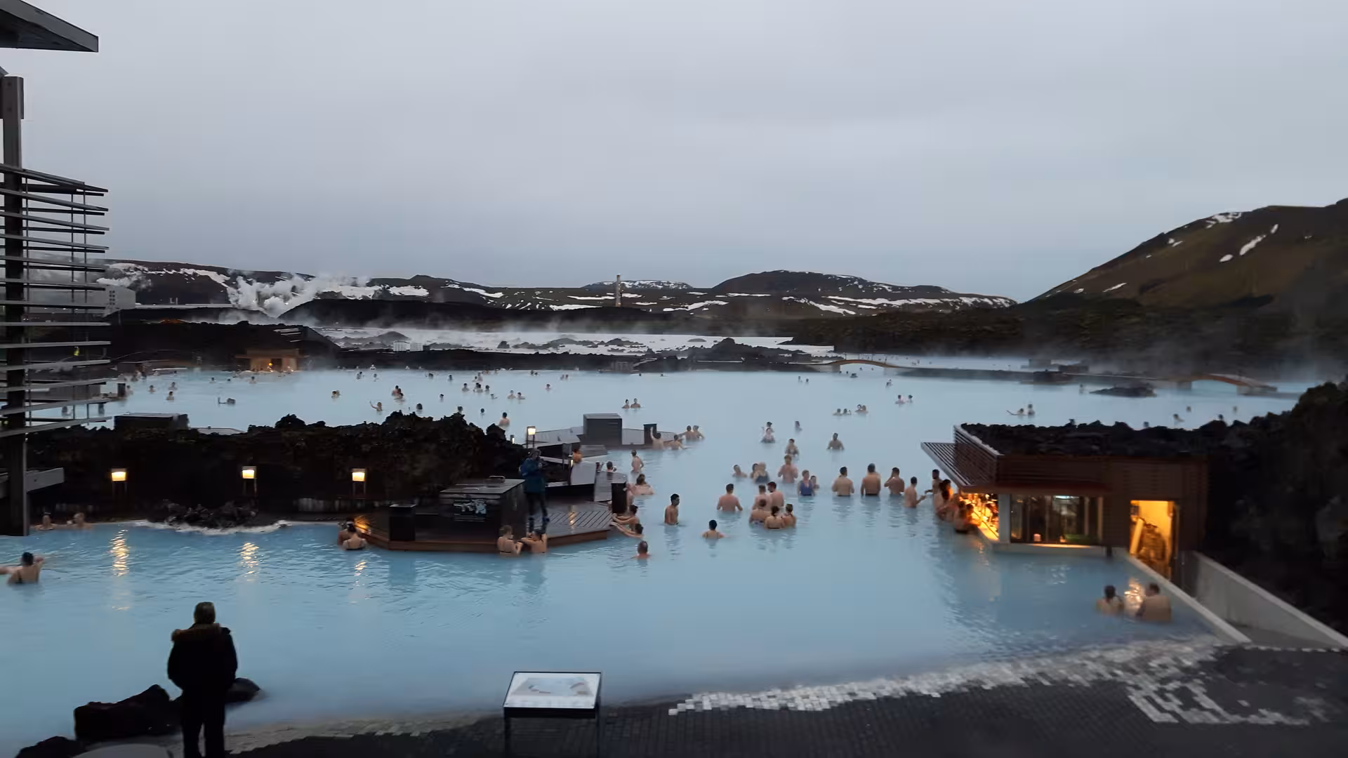 Aerial view of Blue Lagoon geothermal spa in Iceland with milky blue waters and steam rising