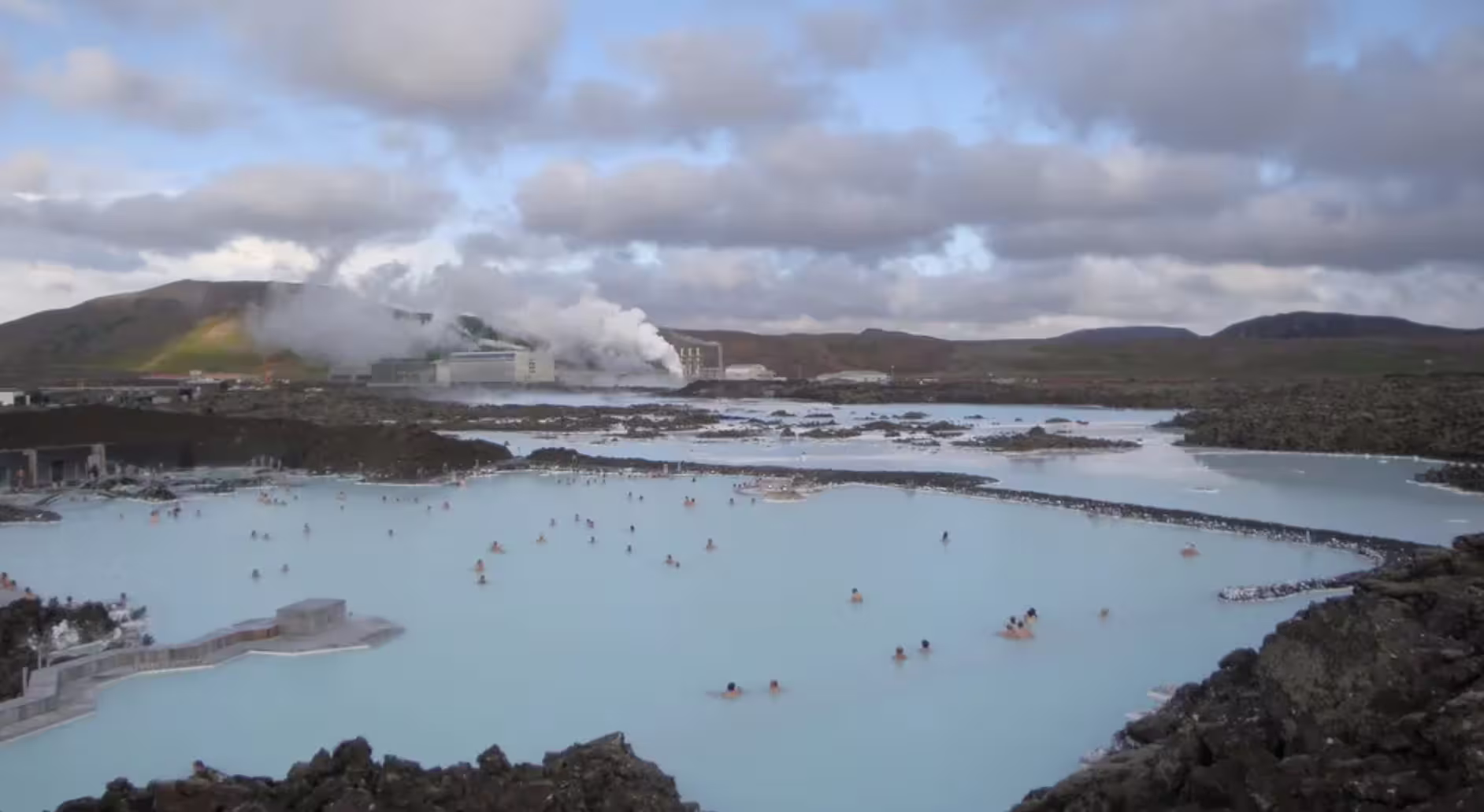 Blue Lagoon geothermal spa with milky blue waters and bathers near Reykjavik, Iceland