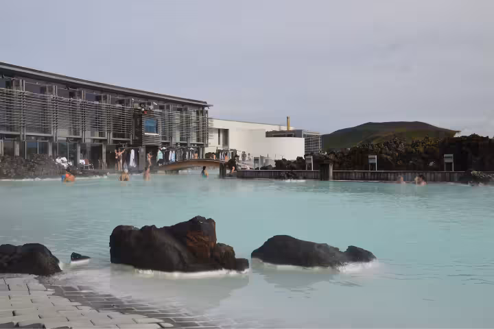 Blue Lagoon geothermal spa with milky turquoise waters, volcanic rocks, and bathers near Reykjavik, Iceland