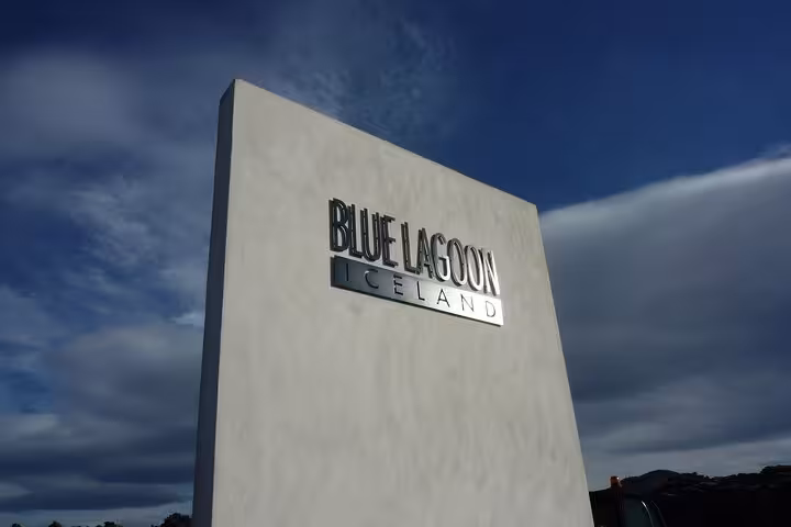Blue Lagoon Iceland entrance sign monument against blue sky
