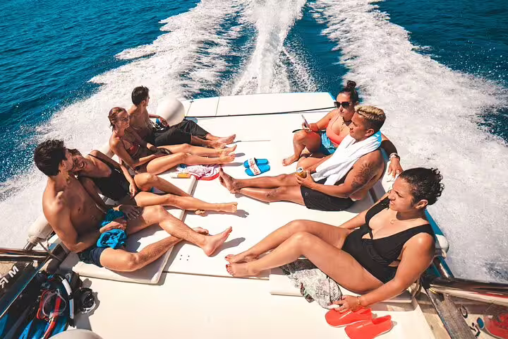 Group relaxing on speedboat deck between Blue Lagoon and 3 Islands, Split boat tour with sea views