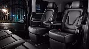 Luxury black leather captain seats inside private transfer van for Blue Lagoon Reykjavik tour