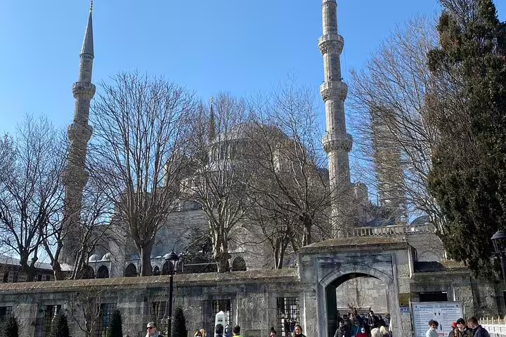 Blue Mosque exterior in Istanbul with minarets and courtyard, part of 8-day Istanbul Cappadocia tour