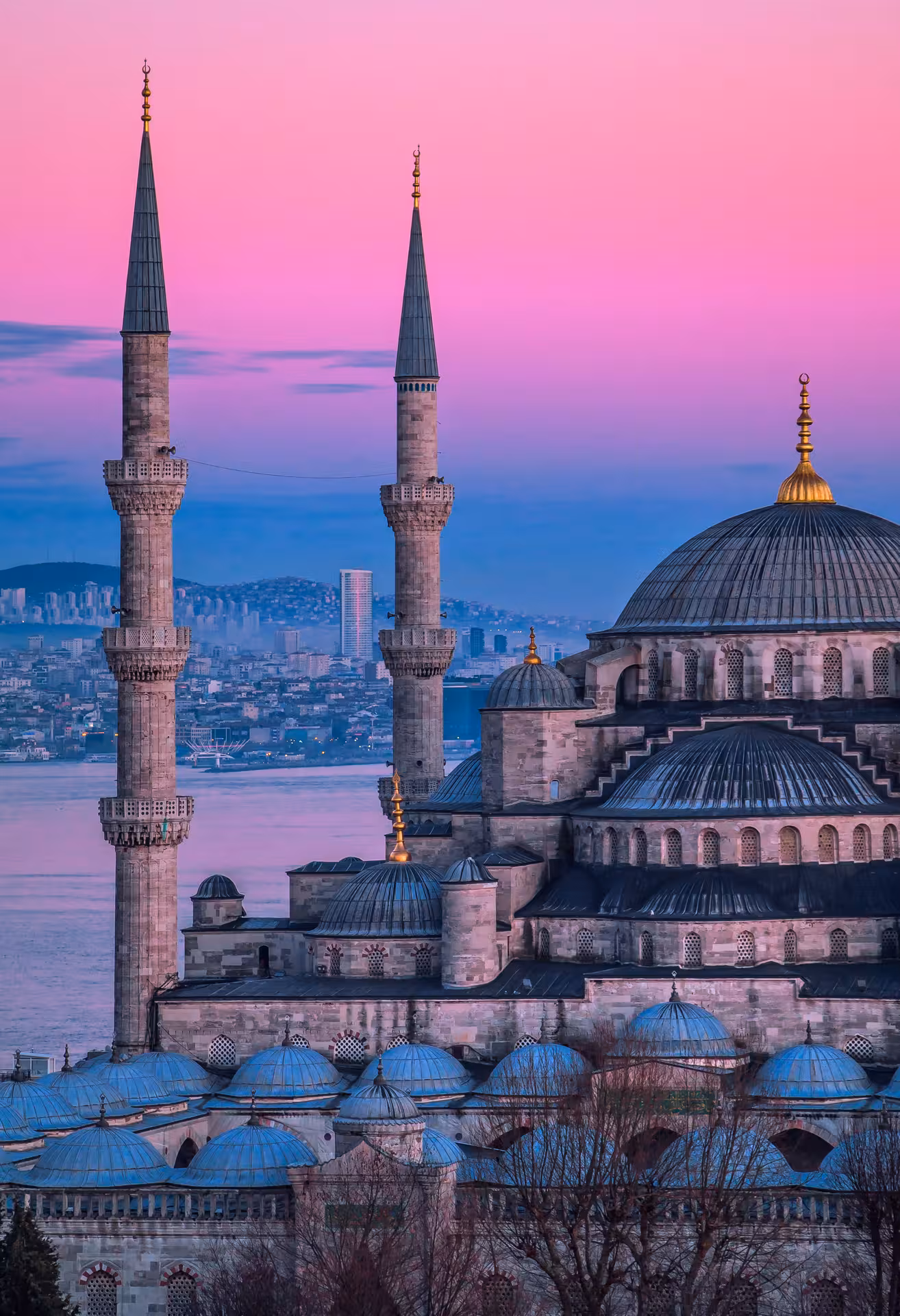 Blue Mosque at sunset over Bosphorus in Istanbul, iconic stop on Timeless Turkey 8 days guided tour