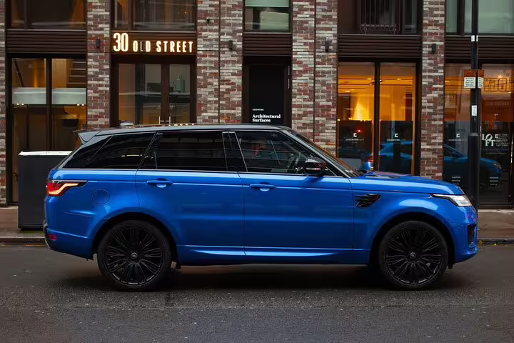Blue Range Rover Sport SUV parked on Old Street London for private airport transfer