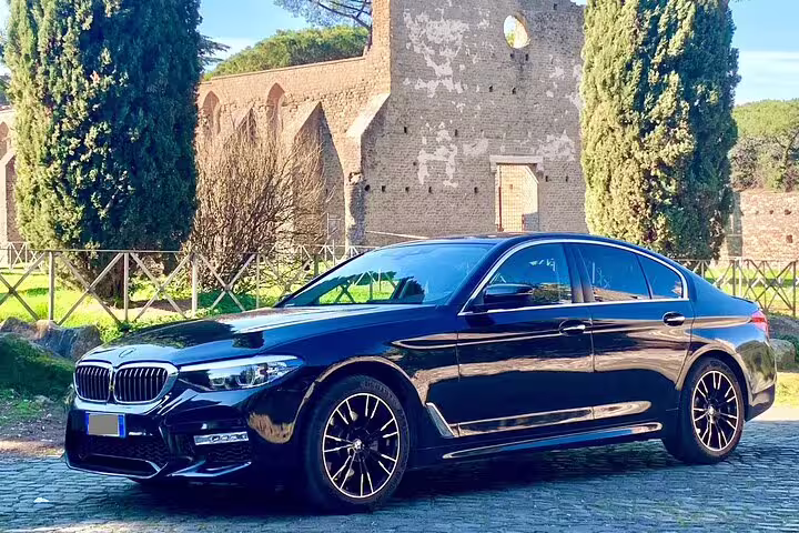 Premium black BMW 5 Series sedan available for private round-trip airport transfer from Berlin BER to Berlin