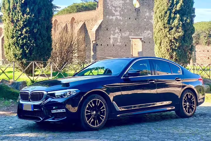 Premium black BMW 5 Series sedan available for private transfer service between Berlin Schonefeld Airport SXF and Berlin