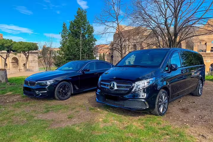 Black BMW sedan and Mercedes V-Class van offering premium private airport transfer service to Trysil Ski Resort