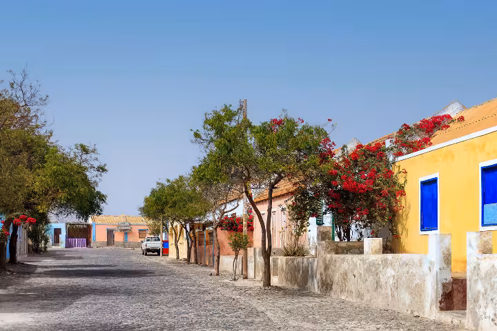 Quiet cobblestone street in Povoação Velha, Boa Vista, ideal for private airport transfer drop-off in Cape Verde