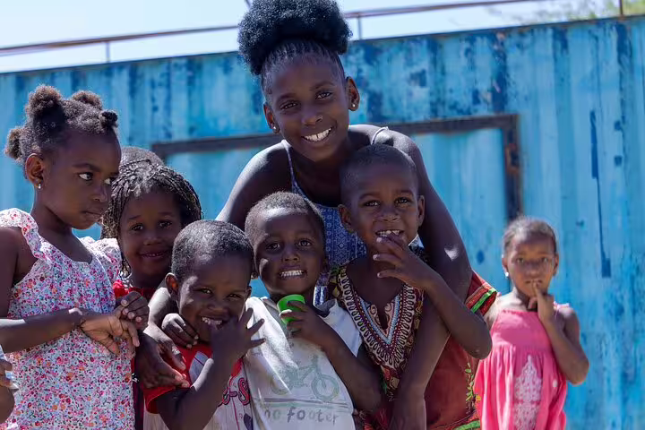 Smiling children gather on Boa Vista Island, capturing the vibrant spirit of local culture and community.
