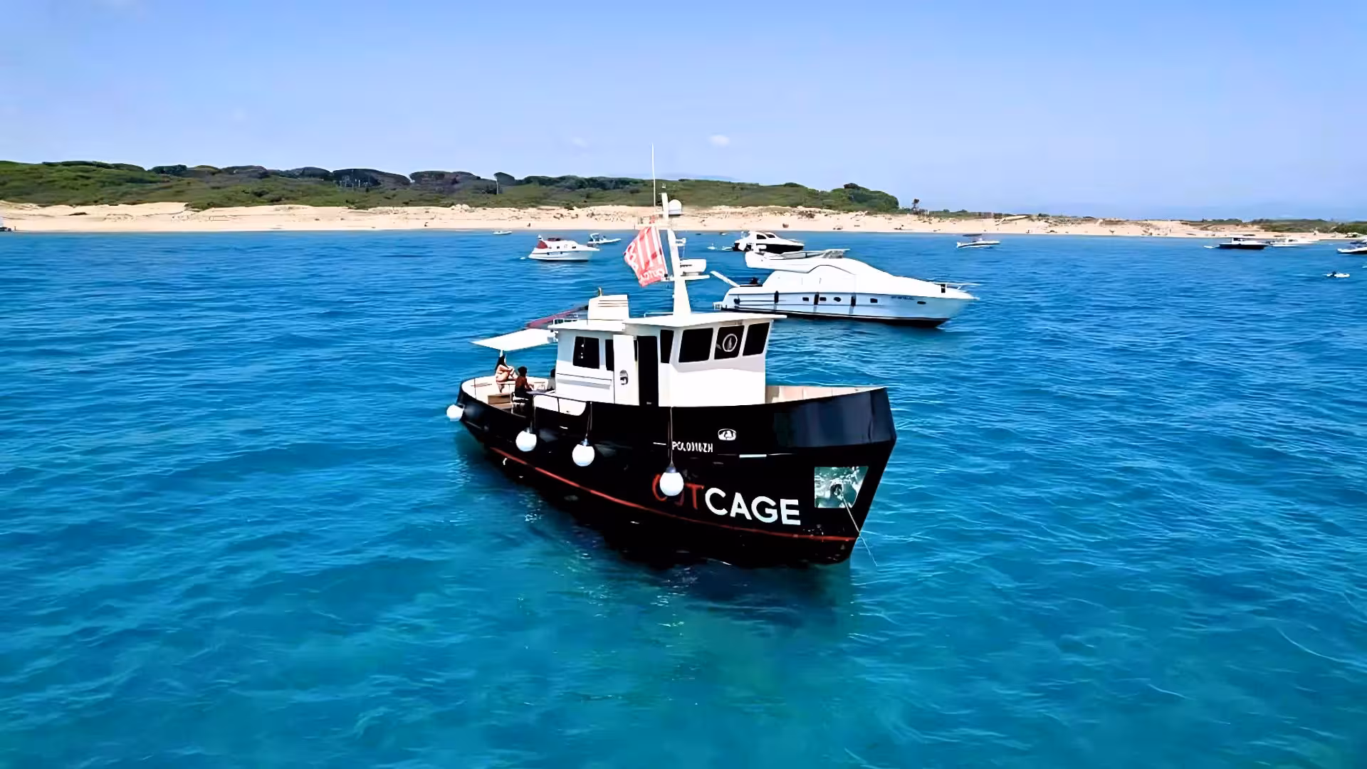 Captivating boat journey near Figarolo Island with clear blue waters and sandy beaches, perfect for Sardinian exploration.