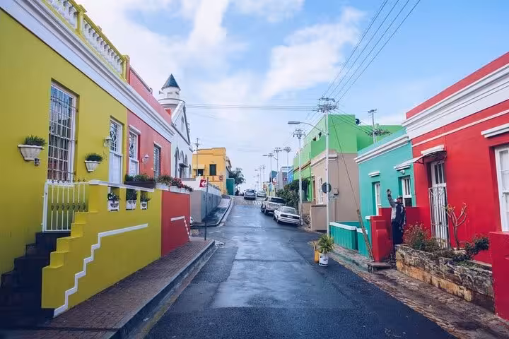 Vibrant colored houses line the street in Bo-Kaap, Cape Town, showcasing cultural heritage and colorful architecture.