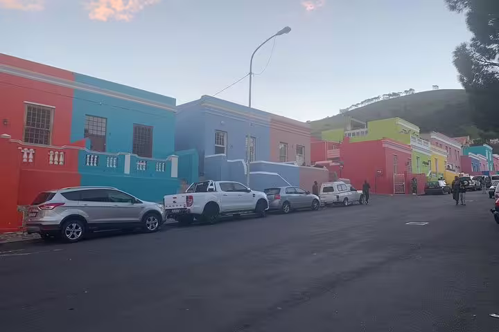 Colorful houses line the vibrant streets of Bo-Kaap, Cape Town, showcasing rich culture and history.