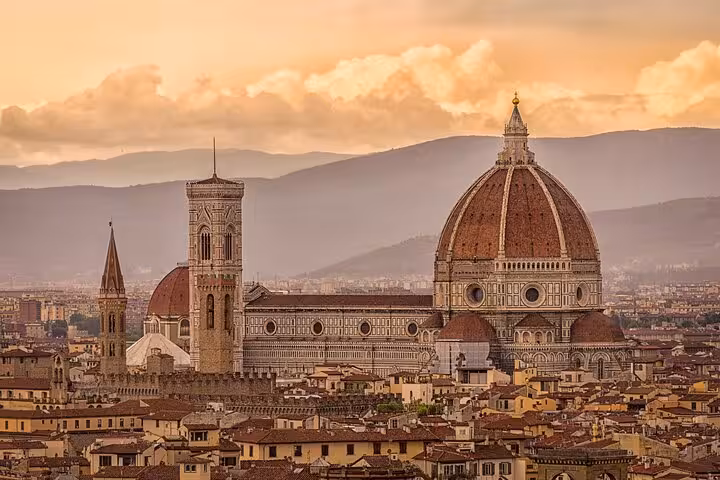 Scenic view of Florence Cathedral at sunset, highlighting the cultural beauty of your transfer destination.