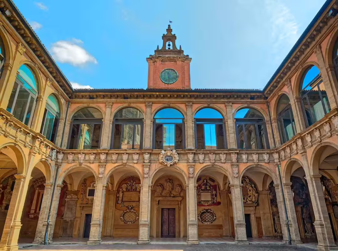 Historic courtyard of the Archiginnasio, former University of Bologna, seen on a guided city and university walking tour